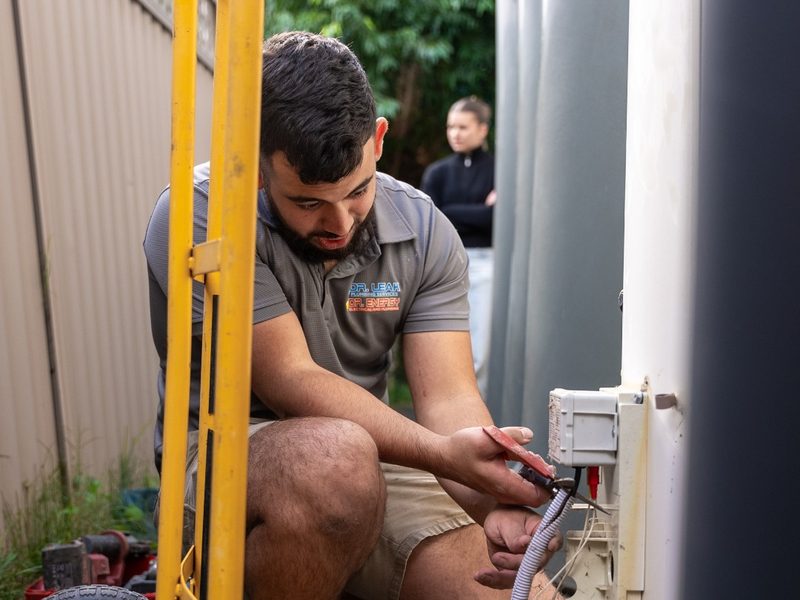 Plumber repairing a hot water tank
